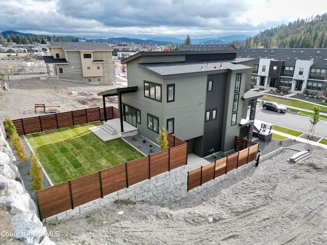 rear view of house with a mountain view