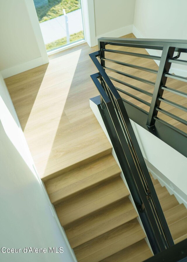 stairway featuring hardwood / wood-style flooring