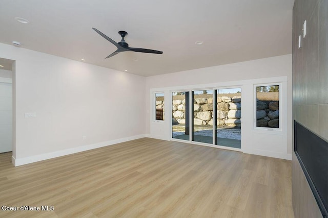 unfurnished living room with light hardwood / wood-style floors and ceiling fan