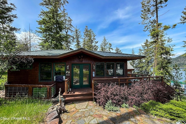 1930 Warren Island Shrs, Hope, ID 83836 - view of front of property with french doors, metal roof, and a deck