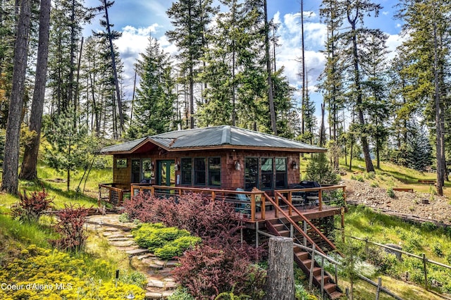 1930 Warren Island Shrs, Hope, ID 83836 - back of house with stairs, a wooden deck, and metal roof