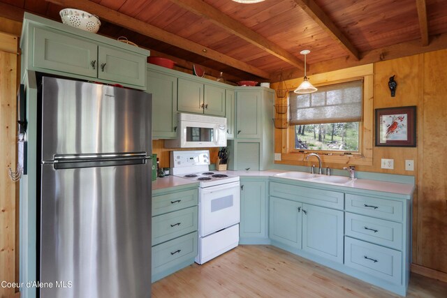 1930 Warren Island Shrs, Hope, ID 83836 - kitchen with beam ceiling, white appliances, wood ceiling, and a sink