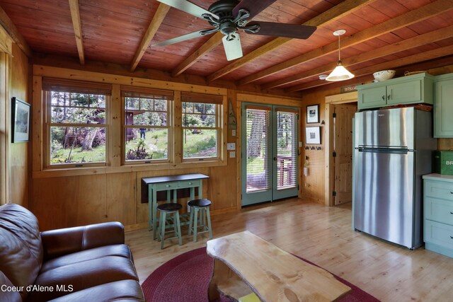 1930 Warren Island Shrs, Hope, ID 83836 - living area with ceiling fan, wood ceiling, light wood-style floors, wood walls, and beamed ceiling