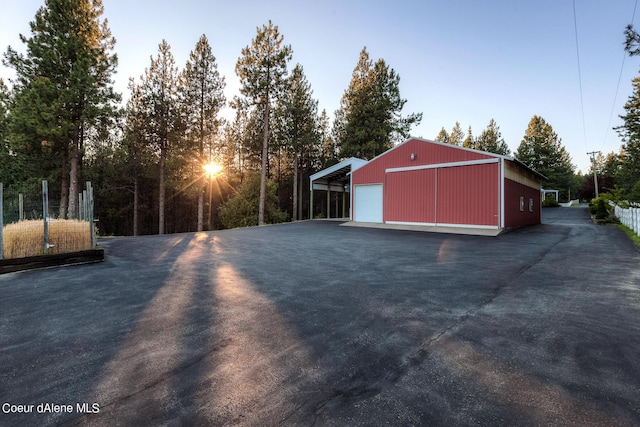 5718 E Sleepy Ln, Coeur Dalene, ID 83814 - view of yard featuring a garage, an outdoor structure, and a pole building