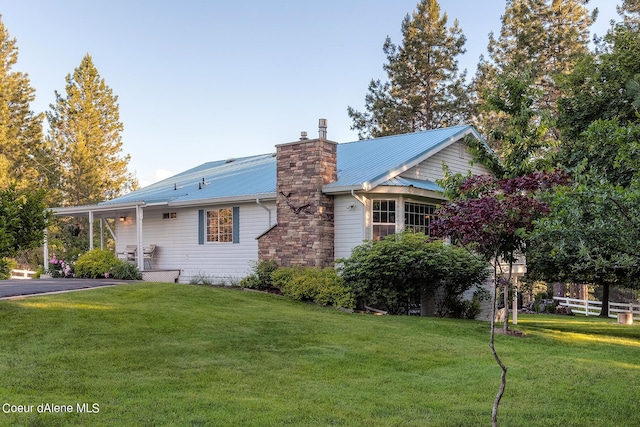 5718 E Sleepy Ln, Coeur Dalene, ID 83814 - view of front of property featuring a metal roof and a chimney