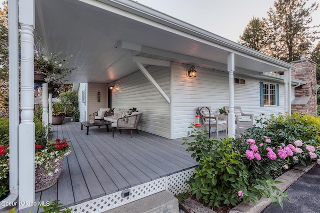5718 E Sleepy Ln, Coeur Dalene, ID 83814 - wooden terrace with an outdoor living space