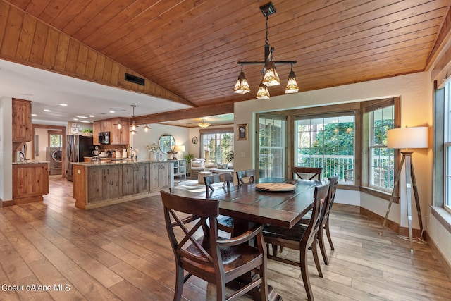 5718 E Sleepy Ln, Coeur Dalene, ID 83814 - dining area featuring light hardwood / wood-style floors, wood ceiling, sink, and an inviting chandelier