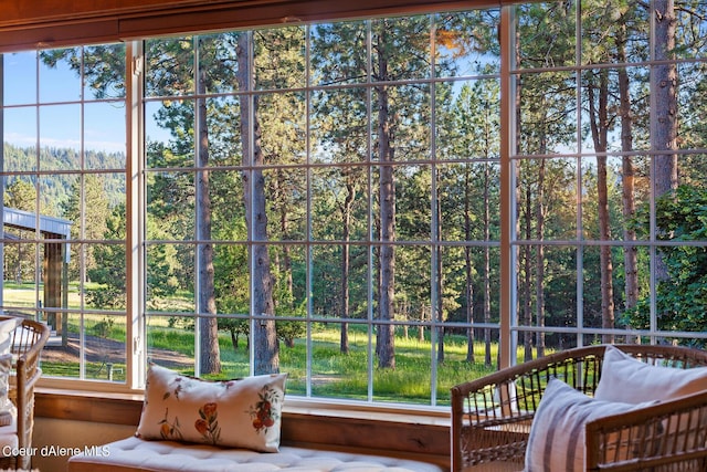 5718 E Sleepy Ln, Coeur Dalene, ID 83814 - sunroom featuring healthy amount of natural light and a forest view