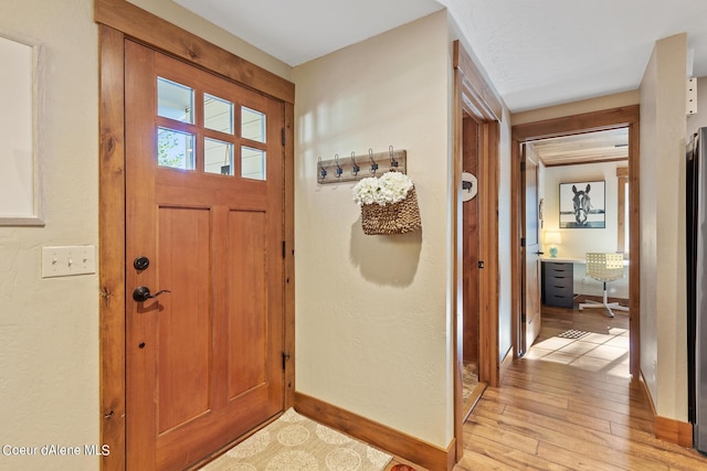 5718 E Sleepy Ln, Coeur Dalene, ID 83814 - foyer with baseboards and light wood finished floors