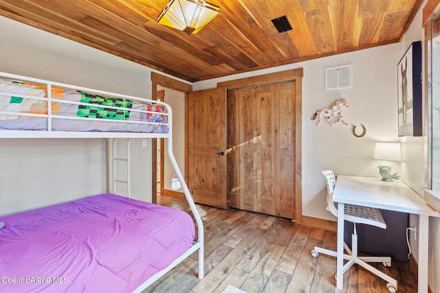 5718 E Sleepy Ln, Coeur Dalene, ID 83814 - bedroom with wood ceiling, light wood finished floors, and a closet