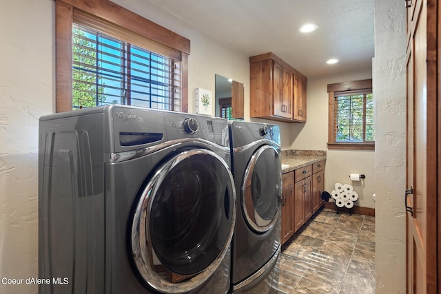 5718 E Sleepy Ln, Coeur Dalene, ID 83814 - washroom featuring independent washer and dryer, stone finish floors, cabinet space, a textured wall, and recessed lighting