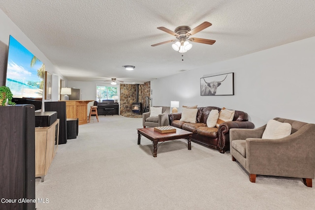 5718 E Sleepy Ln, Coeur Dalene, ID 83814 - living area with ceiling fan, light colored carpet, a textured ceiling, and a wood stove