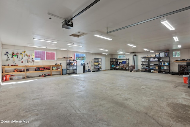 5718 E Sleepy Ln, Coeur Dalene, ID 83814 - garage featuring a garage door opener and a workshop area