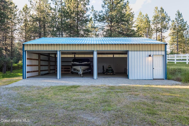 5718 E Sleepy Ln, Coeur Dalene, ID 83814 - detached garage featuring view of scattered trees