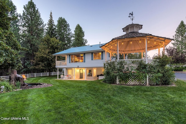 5718 E Sleepy Ln, Coeur Dalene, ID 83814 - back of house featuring a gazebo, a balcony, a metal roof, and a porch
