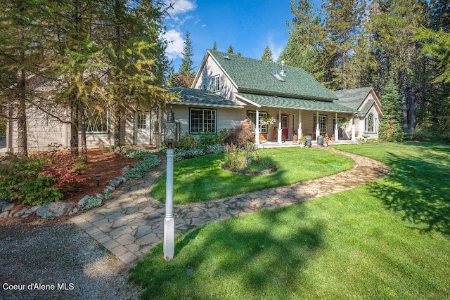 view of front facade with a front lawn and covered porch