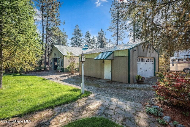 view of outbuilding with a yard