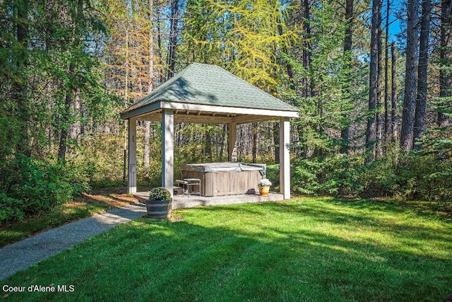 view of yard with a gazebo and a hot tub