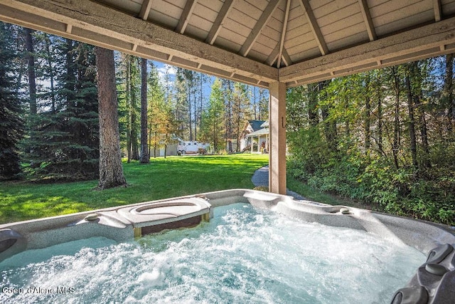 view of patio / terrace with a hot tub