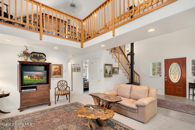 living room featuring a high ceiling