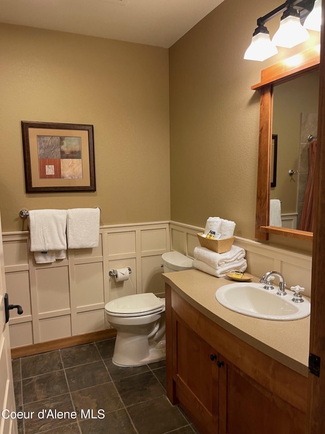 bathroom with toilet and vanity