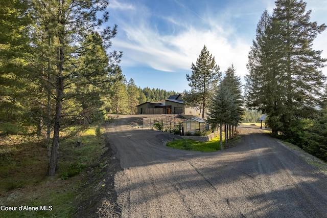 view of road with driveway