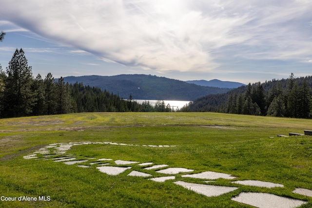 property view of mountains featuring a wooded view