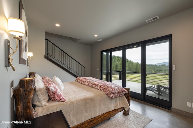 bedroom featuring finished concrete flooring, visible vents, access to outside, french doors, and recessed lighting