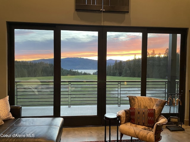 interior space with a water and mountain view