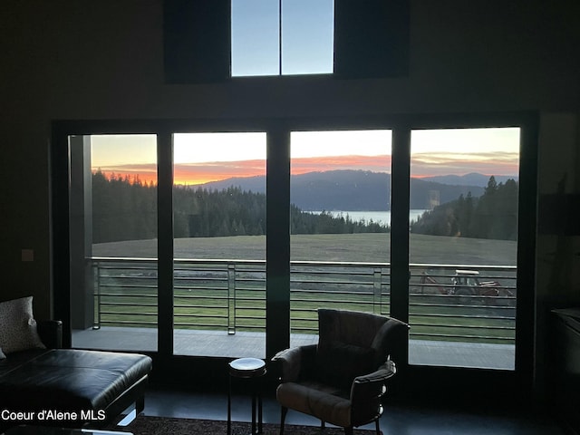 interior space with a water and mountain view