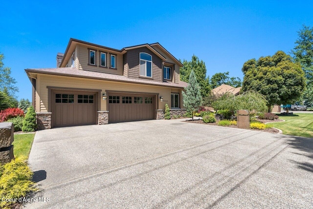 view of front of property featuring a garage and a front yard