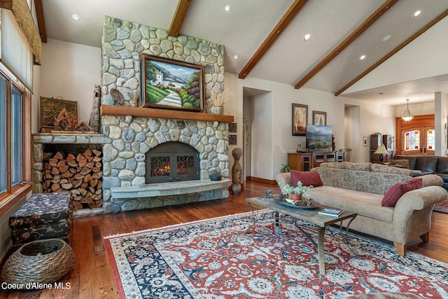 living room featuring a stone fireplace, recessed lighting, beamed ceiling, high vaulted ceiling, and wood finished floors