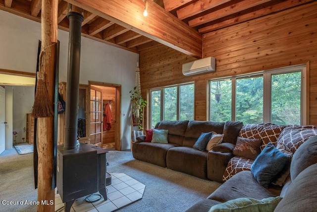 living room featuring a wall mounted air conditioner, a wood stove, light carpet, a high ceiling, and a wealth of natural light