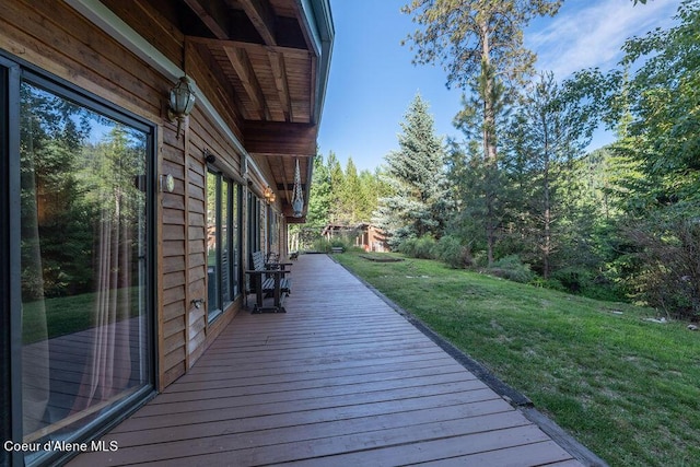 wooden deck with a yard