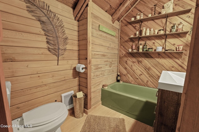 bathroom with a tub, hardwood / wood-style floors, wooden walls, and beamed ceiling