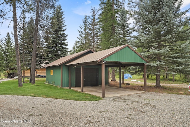 exterior space featuring a yard and a carport