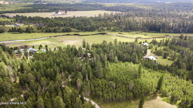 birds eye view of property featuring a rural view