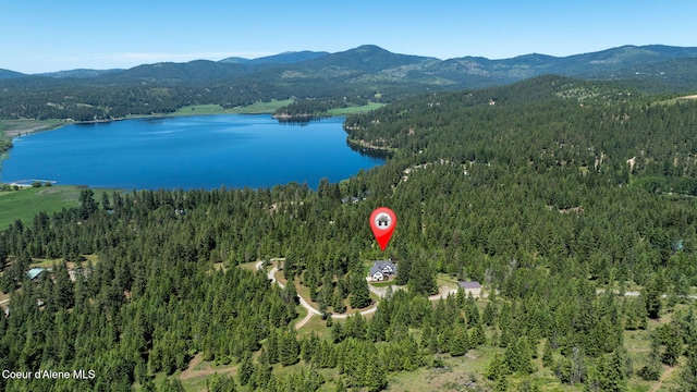 17536 W Julia Dr, Hauser, ID 83854 - aerial view of a heavily wooded area and a water and mountain view
