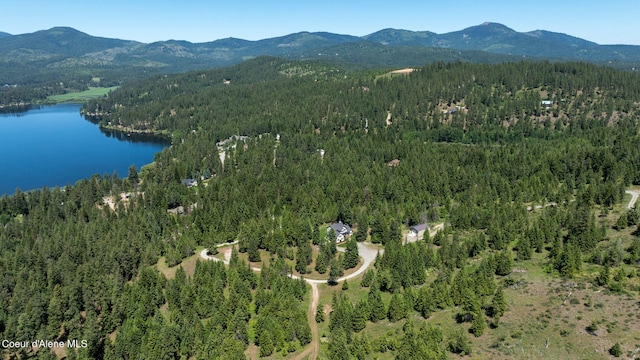 17536 W Julia Dr, Hauser, ID 83854 - drone / aerial view of a heavily wooded area and a water and mountain view