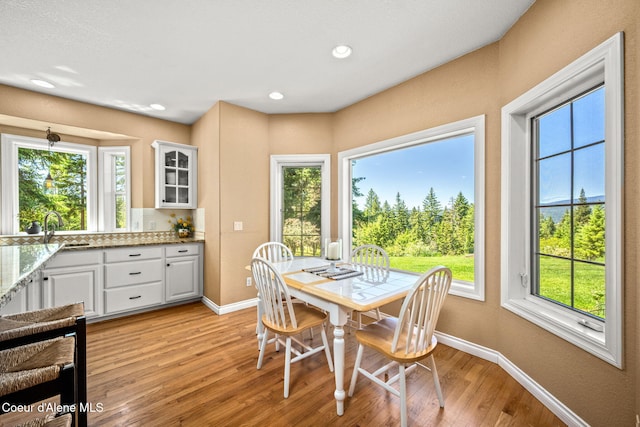 17536 W Julia Dr, Hauser, ID 83854 - dining area with light wood-style flooring and recessed lighting