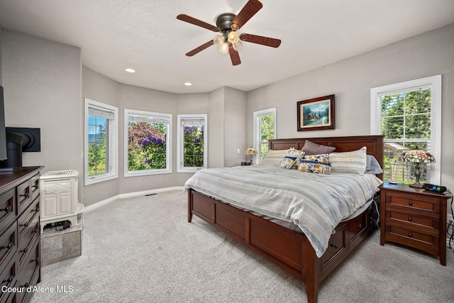 17536 W Julia Dr, Hauser, ID 83854 - bedroom with light carpet, recessed lighting, and ceiling fan