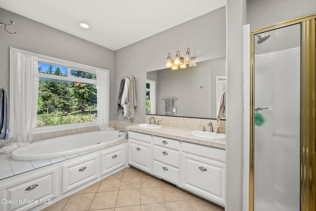 17536 W Julia Dr, Hauser, ID 83854 - full bath with double vanity, tile patterned flooring, a bath, and a stall shower