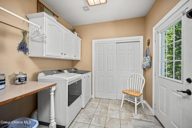 17536 W Julia Dr, Hauser, ID 83854 - laundry room with cabinet space, healthy amount of natural light, and washing machine and clothes dryer