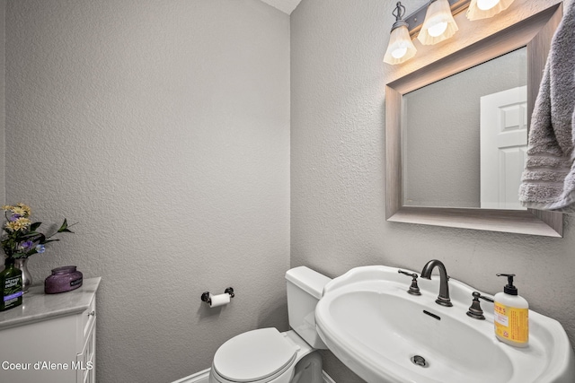 17536 W Julia Dr, Hauser, ID 83854 - half bathroom featuring a sink and toilet