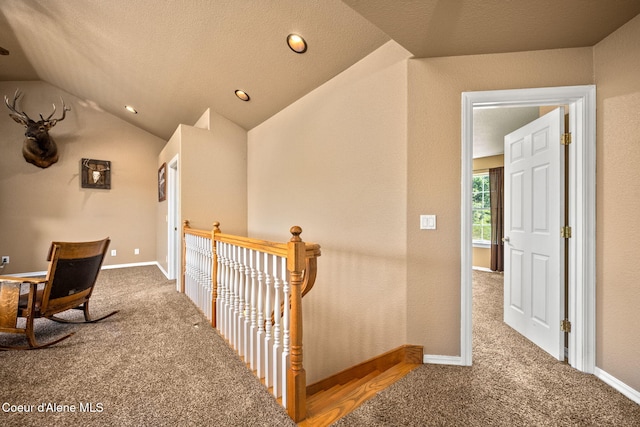 17536 W Julia Dr, Hauser, ID 83854 - corridor featuring lofted ceiling, carpet flooring, an upstairs landing, and recessed lighting