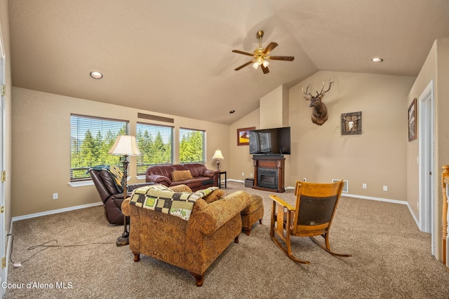 17536 W Julia Dr, Hauser, ID 83854 - carpeted living area with lofted ceiling, a ceiling fan, a glass covered fireplace, and recessed lighting
