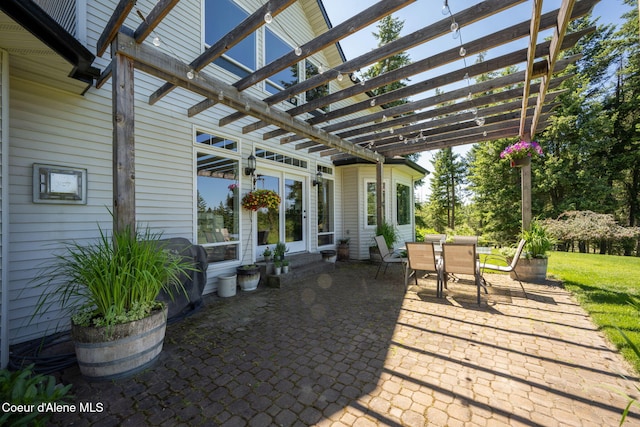 17536 W Julia Dr, Hauser, ID 83854 - view of patio / terrace featuring outdoor dining space and a pergola