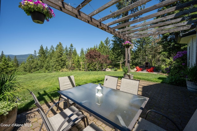 17536 W Julia Dr, Hauser, ID 83854 - view of patio featuring outdoor dining area and a pergola
