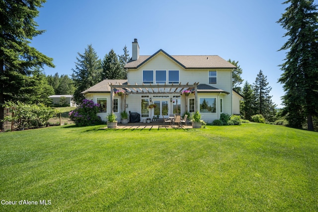 17536 W Julia Dr, Hauser, ID 83854 - rear view of property with a pergola, a chimney, a yard, and a patio area