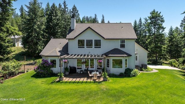 17536 W Julia Dr, Hauser, ID 83854 - back of house with a yard, a chimney, a patio area, and a pergola